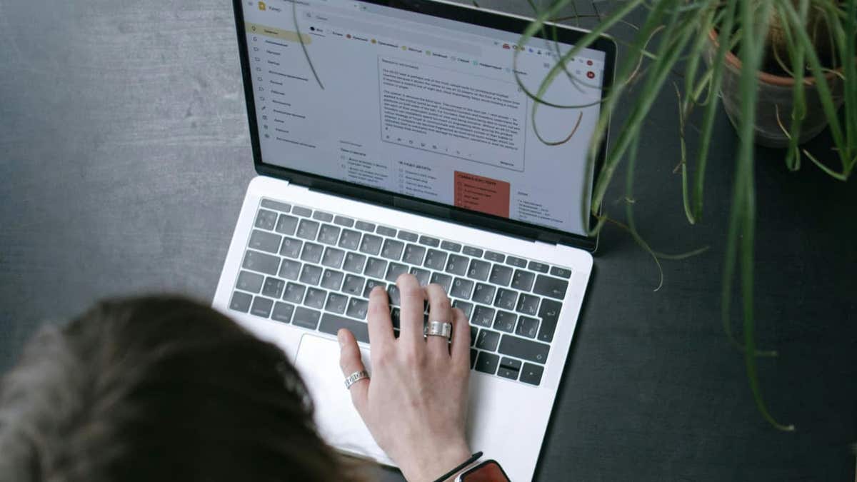person typing on laptop