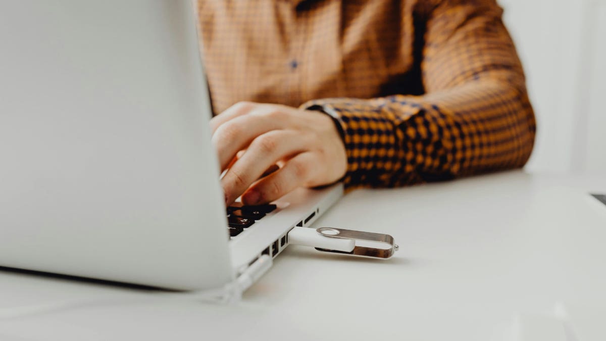 typing on a laptop