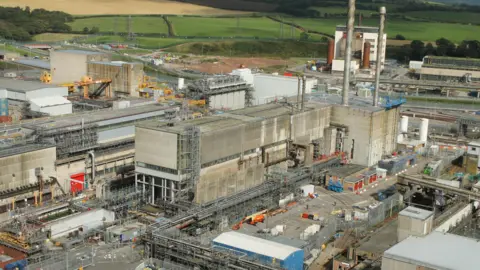 Sellafield The Magnox Swarf Storage Silo (MSSS). Several concrete nuclear buildings with several chimneys are in operation at Sellafield.