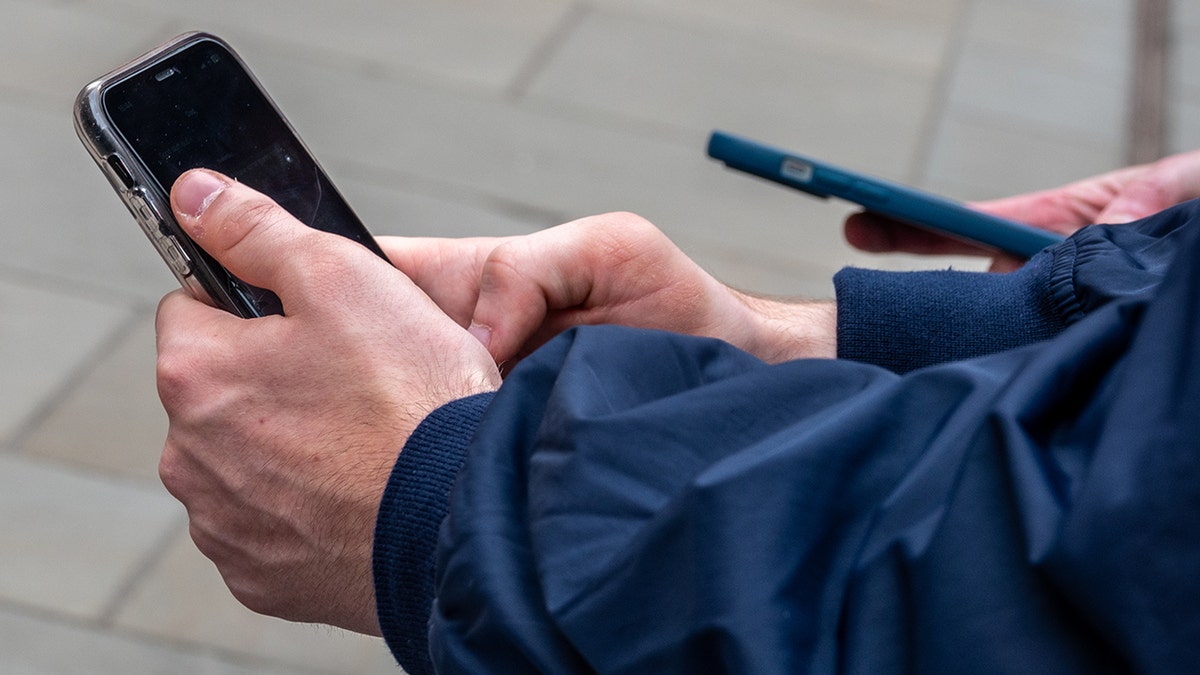 Person on their smartphone.