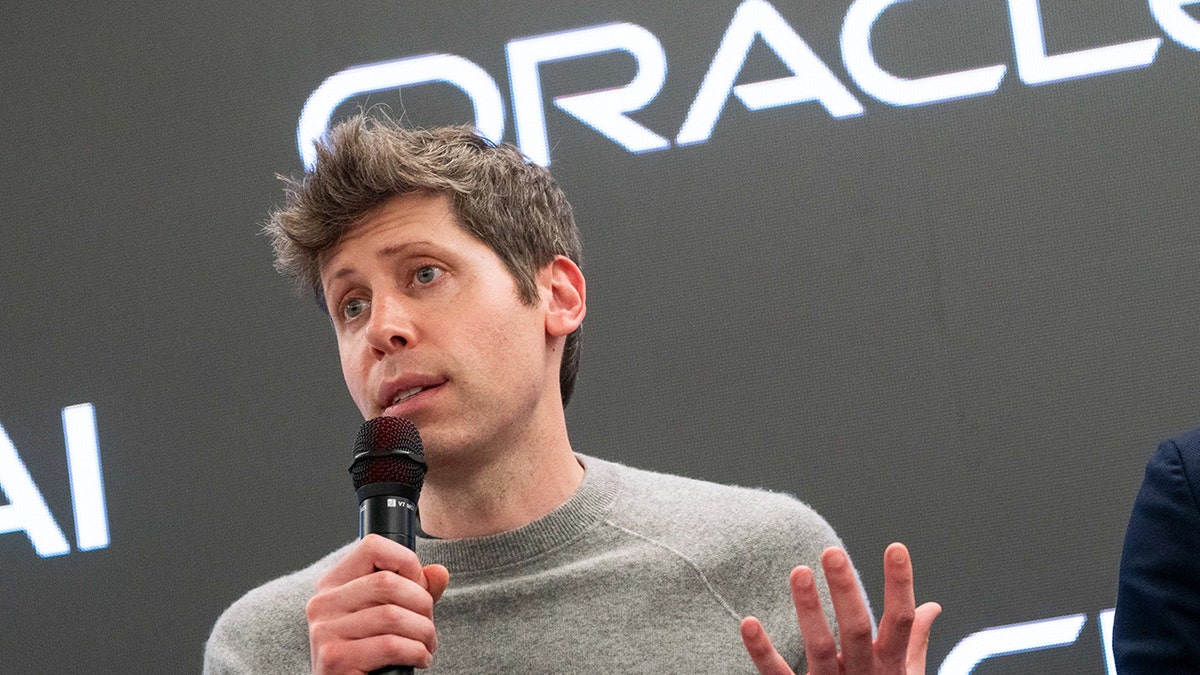 Sam Altman speaking into a microphone